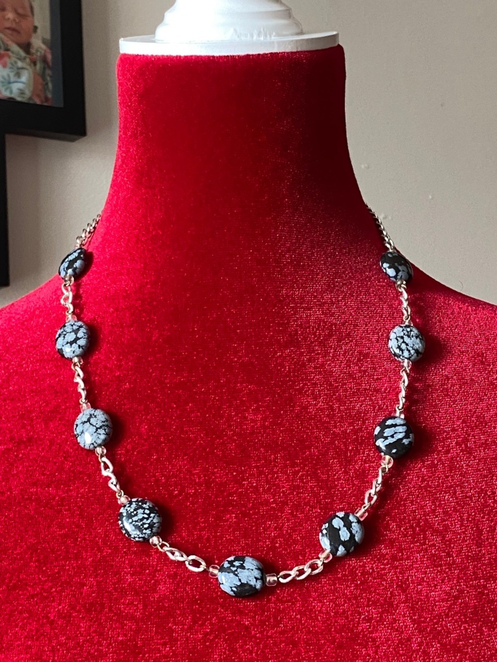 necklace featuring snowflake obsidian gemstone beads